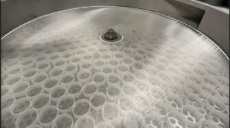 Compass Wire Cloth's vibratory screen with sliders.