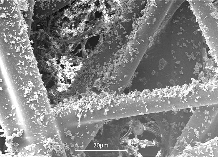 Figure 9: Dust and other particles (top) recovered from a cabin air filter (bottom).