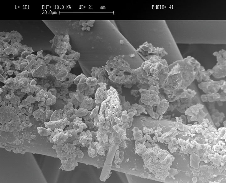 Figure 7: SEM of pre-mature dust-cake formation on a depth filter media.[5}]