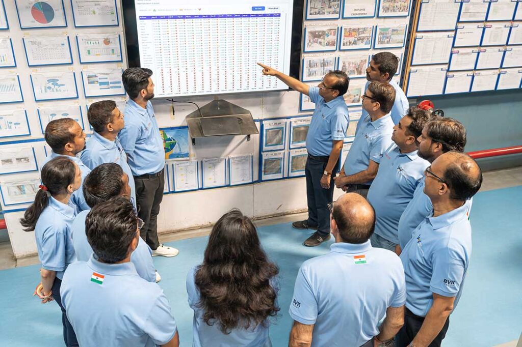 Employees gathered in a daily meeting discussing production and other plant matters. Photo courtesy of BVK Group