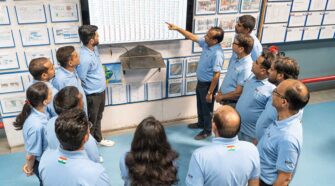 Employees gathered in a daily meeting discussing production and other plant matters. Photo courtesy of BVK Group