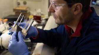 Jovan Kamcev inserts a carbon cloth electrode into a flow cell for water desalination.